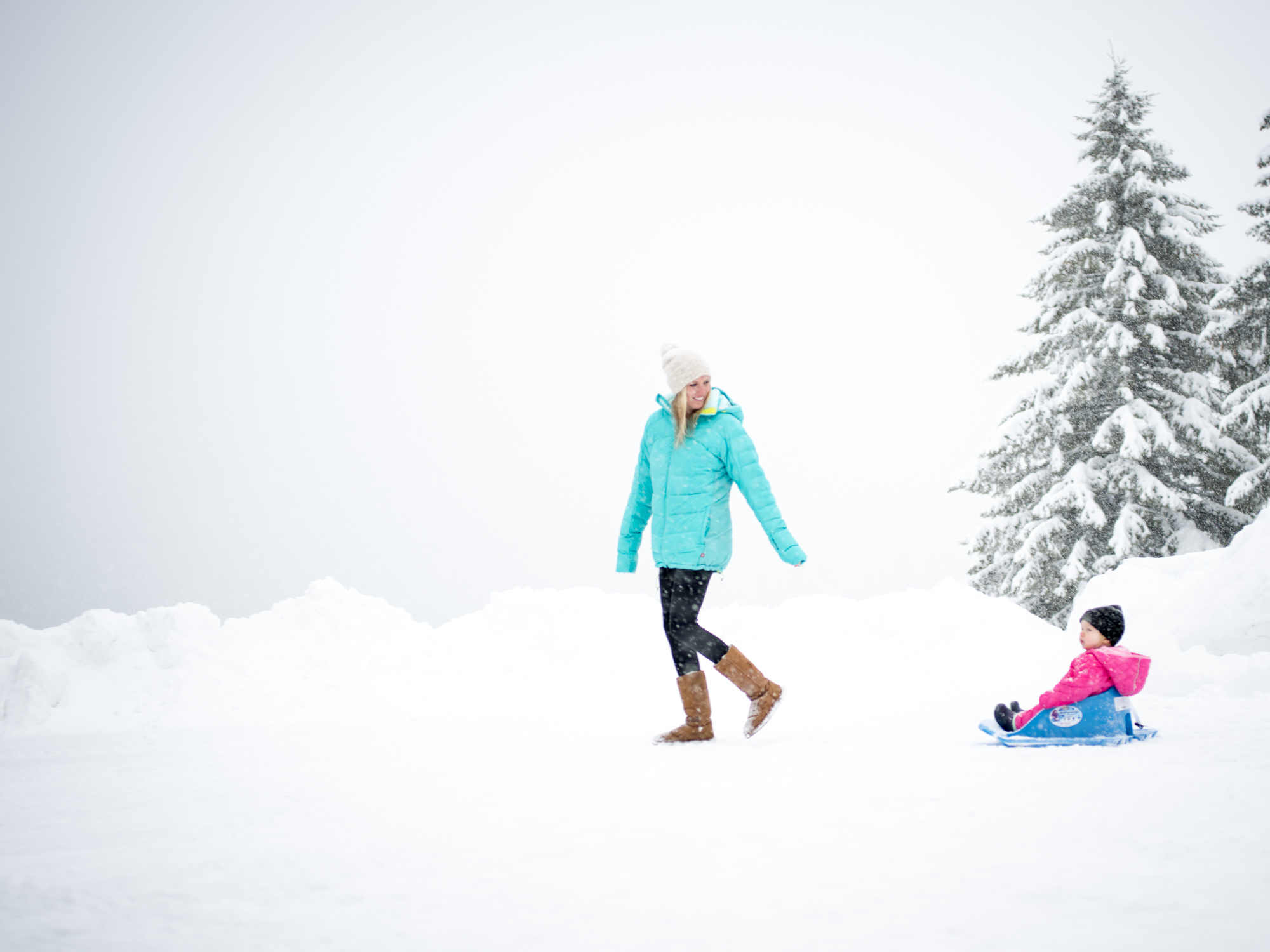Mother and child playing in the snow. McCall, Idaho